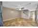Living room with tan flooring and staircase at 4239 Brentwood Park Cir, Tampa, FL 33624