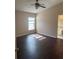 Bedroom with a ceiling fan, wood floors, natural light and an en-suite bathroom at 4706 Dragon Tail Ct, Valrico, FL 33594