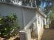 Exterior of a house with a leafy bush and an AC unit at 4706 Dragon Tail Ct, Valrico, FL 33594