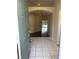 Inviting foyer featuring tiled flooring and an open archway leading to the rest of the home at 4706 Dragon Tail Ct, Valrico, FL 33594