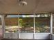 View of the backyard from inside the enclosed patio area at 4706 Dragon Tail Ct, Valrico, FL 33594