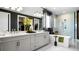Elegant bathroom with a modern freestanding tub, dual vanity, and a walk-in shower with sleek fixtures at 14448 Woodland Preserve Trl, Parrish, FL 34219