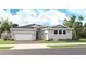 Charming single-story home with a two-car garage, tidy landscaping, and welcoming front entrance at 14448 Woodland Preserve Trl, Parrish, FL 34219