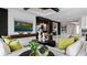 Bright living room with modern decor, black ceiling beams, stylish artwork, and ample seating at 14448 Woodland Preserve Trl, Parrish, FL 34219