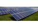Extensive solar panel field with a lush green ground cover at 42850 Park View Dr, Punta Gorda, FL 33982