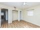 Comfortable bedroom featuring closet space, hardwood floors, and a soothing atmosphere at 6310 Cecelia Dr, New Port Richey, FL 34653