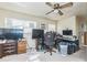 Bedroom with ceiling fan and carpet and various objects at 6310 Cecelia Dr, New Port Richey, FL 34653
