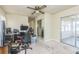 Bedroom with ceiling fan, carpet, and a closet at 6310 Cecelia Dr, New Port Richey, FL 34653