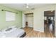 Bedroom with hardwood floors, a ceiling fan, and closet space at 6310 Cecelia Dr, New Port Richey, FL 34653