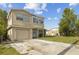 Charming two-story home with attached garage, and a spacious driveway at 6310 Cecelia Dr, New Port Richey, FL 34653