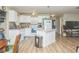 Bright kitchen featuring white cabinets and an island at 6310 Cecelia Dr, New Port Richey, FL 34653