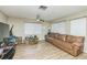 Bright living space with wood-style flooring, and comfortable seating at 6310 Cecelia Dr, New Port Richey, FL 34653