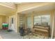 Covered porch with piano and patio set at 6310 Cecelia Dr, New Port Richey, FL 34653