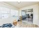 Sunroom with wood laminate flooring and lots of windows, bright open space at 6310 Cecelia Dr, New Port Richey, FL 34653