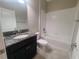 Clean bathroom with a granite vanity, tiled floor, and a shower-tub combination at 13209 Haystack Ct, Riverview, FL 33579