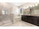 A bathroom featuring a soaking tub, glass enclosed shower, and vanity with double sinks at 13209 Haystack Ct, Riverview, FL 33579