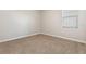 Carpeted bedroom with neutral paint and a window providing natural light at 13209 Haystack Ct, Riverview, FL 33579