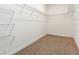 Walk-in closet with metal shelving, offering ample storage space at 13209 Haystack Ct, Riverview, FL 33579