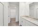 Elegant bathroom boasting dual sinks, granite countertops, and modern fixtures at 1732 Brekey Way, Zephyrhills, FL 33541