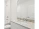 Bathroom featuring granite vanity and tile surround shower and tub at 1732 Brekey Way, Zephyrhills, FL 33541