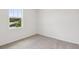 Neutral bedroom with carpet and a window view at 1732 Brekey Way, Zephyrhills, FL 33541