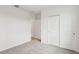 Clean, carpeted bedroom with a closet and neutral walls at 1732 Brekey Way, Zephyrhills, FL 33541