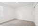 Bedroom featuring carpet and a window at 1732 Brekey Way, Zephyrhills, FL 33541