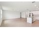Bright and spacious living room featuring tile flooring and a seamless open-concept design at 1732 Brekey Way, Zephyrhills, FL 33541