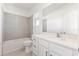 Clean bathroom with tiled shower and modern vanity with white countertops at 17330 Alderwood Ln, Punta Gorda, FL 33982
