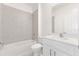 Clean bathroom with tiled shower and modern vanity with white countertops at 17330 Alderwood Ln, Punta Gorda, FL 33982