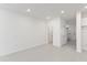 Bright, spacious bedroom with neutral walls, recessed lighting, and adjacent hallway at 17330 Alderwood Ln, Punta Gorda, FL 33982