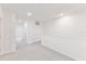 Bright hallway with neutral carpet, white walls, and closet at 17330 Alderwood Ln, Punta Gorda, FL 33982