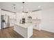 Modern kitchen featuring stainless steel appliances and a spacious island at 1775 Draughton Dr, Zephyrhills, FL 33541