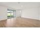 Bright, open living room featuring sliding glass doors to a covered patio at 1775 Draughton Dr, Zephyrhills, FL 33541