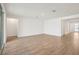 Bright living room with wood-look tile flooring and lots of natural light at 1775 Draughton Dr, Zephyrhills, FL 33541