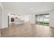 Bright open-concept area featuring dining area and a modern kitchen at 1775 Draughton Dr, Zephyrhills, FL 33541
