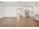 Open-concept living room with modern tile flooring, connecting to a well-appointed kitchen at 1775 Draughton Dr, Zephyrhills, FL 33541