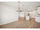 Open-concept room featuring dining area and an adjacent modern kitchen at 1775 Draughton Dr, Zephyrhills, FL 33541