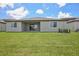 An expansive, well-maintained backyard with a home at 1806 Draughton Dr, Zephyrhills, FL 33541