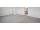 Large bedroom with neutral-colored carpet and an en-suite bathroom at 1806 Draughton Dr, Zephyrhills, FL 33541
