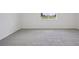 Bright bedroom featuring neutral carpet and natural light at 1806 Draughton Dr, Zephyrhills, FL 33541