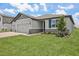 Charming home exterior with well-maintained lawn and landscaping at 1806 Draughton Dr, Zephyrhills, FL 33541