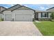 Charming single-Gathering home with a well-manicured lawn and an inviting two-car garage at 1806 Draughton Dr, Zephyrhills, FL 33541