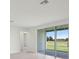 Bright living room with sliding glass doors at 1806 Draughton Dr, Zephyrhills, FL 33541