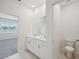 Bright bathroom featuring double sinks and tile flooring at 1817 Draughton Dr, Zephyrhills, FL 33541