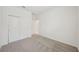 Neutral bedroom with carpet flooring and a closet at 1817 Draughton Dr, Zephyrhills, FL 33541
