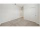 Neutral bedroom with carpet flooring and a closet at 1817 Draughton Dr, Zephyrhills, FL 33541