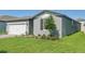 Exterior of a single-Gathering home with well-manicured lawn at 1817 Draughton Dr, Zephyrhills, FL 33541