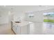 Bright eat-in kitchen featuring stainless steel appliances and tile flooring at 1817 Draughton Dr, Zephyrhills, FL 33541