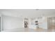 Bright kitchen features stainless steel appliances, white cabinets, and a center island at 1817 Draughton Dr, Zephyrhills, FL 33541